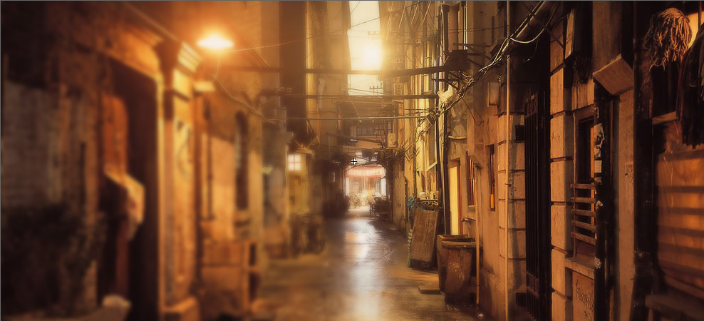 A warmly lit alleyway near Kevin's Old House